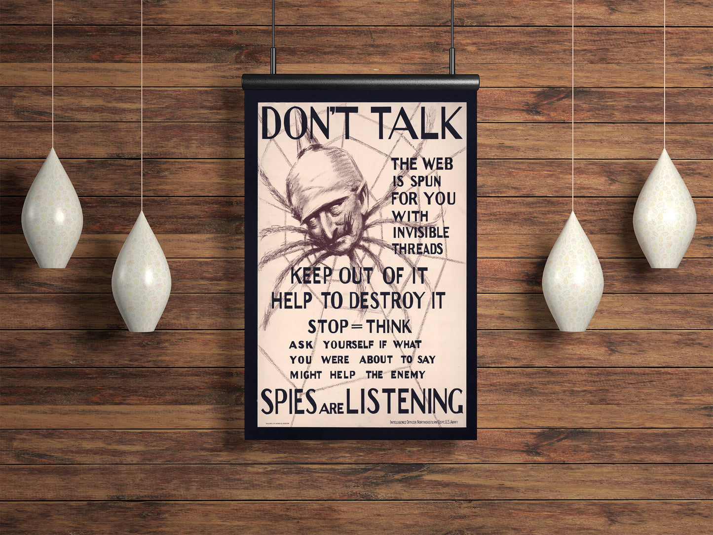 a ww1 anti-spy poster on a wood background